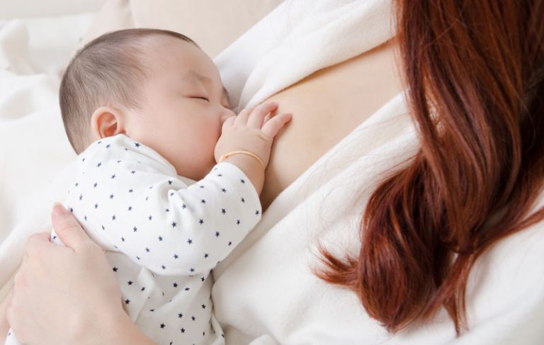 Mother Breastfeeding The Baby