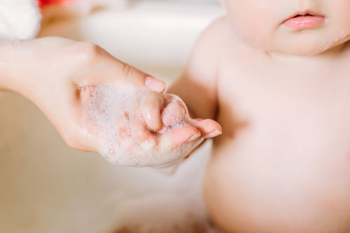 Use a non-soap based body wash when showering your baby.