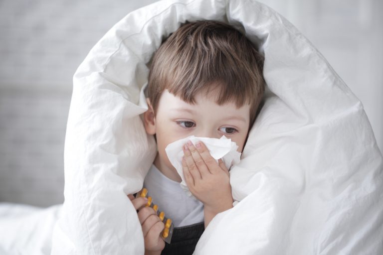 Young Child Suffering From Influenza