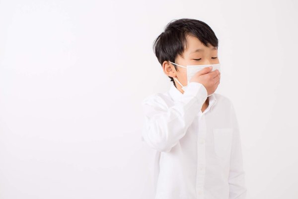 Coughing Child Wearing A Mask