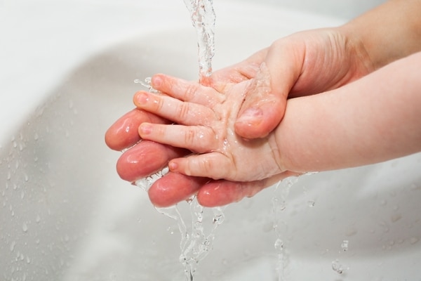 Mother Helps Baby To Wash Hands