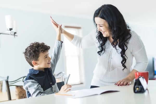 A Mother Encouraging her Son with ADHD as part of Behavioural Therapy