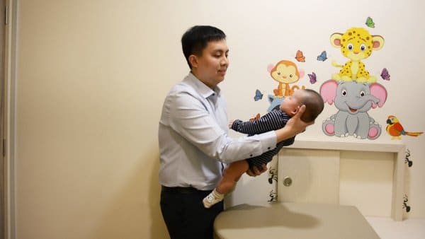 Dr Dave Ong Holding A Baby For Health Checkup