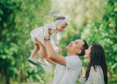 Father and Mother Holding A Child Father Carrying Toddler