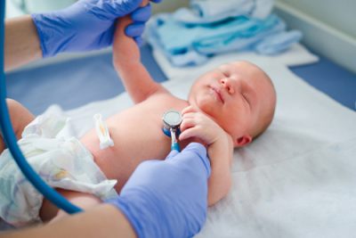 Doctor Checking For Heart Abnormalities In A Newborn