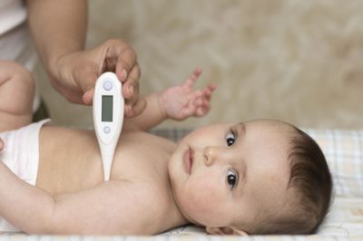 Fever And Temperature Taking With Digital Thermometer